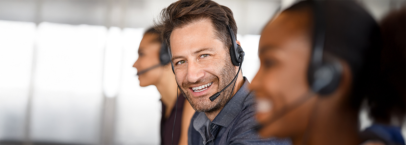 People in a call centre with headsets.
