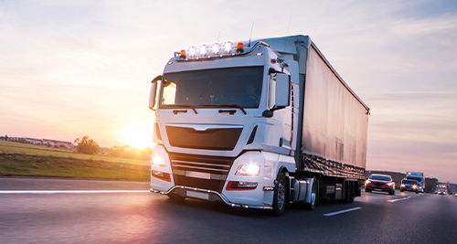 A truck from the freight forwarding industry transports goods on the motorway.